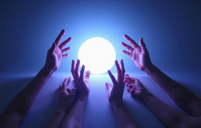 Abstract hands reaching out to a glowing sphere, symbolizing data control and user rights.
